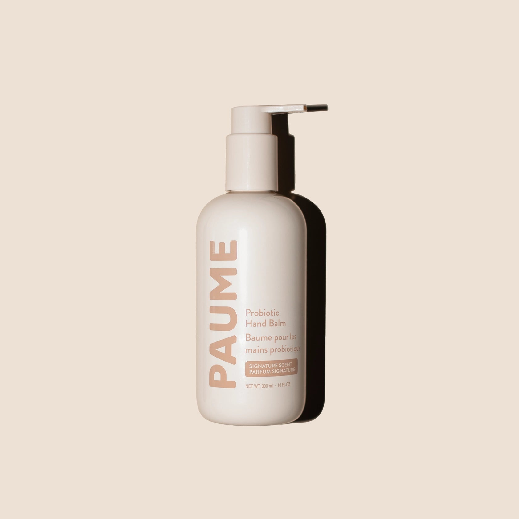 PAUME probiotic hand balm bottle on a beige background