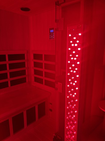 Red-lit room with a shelf and light fixture