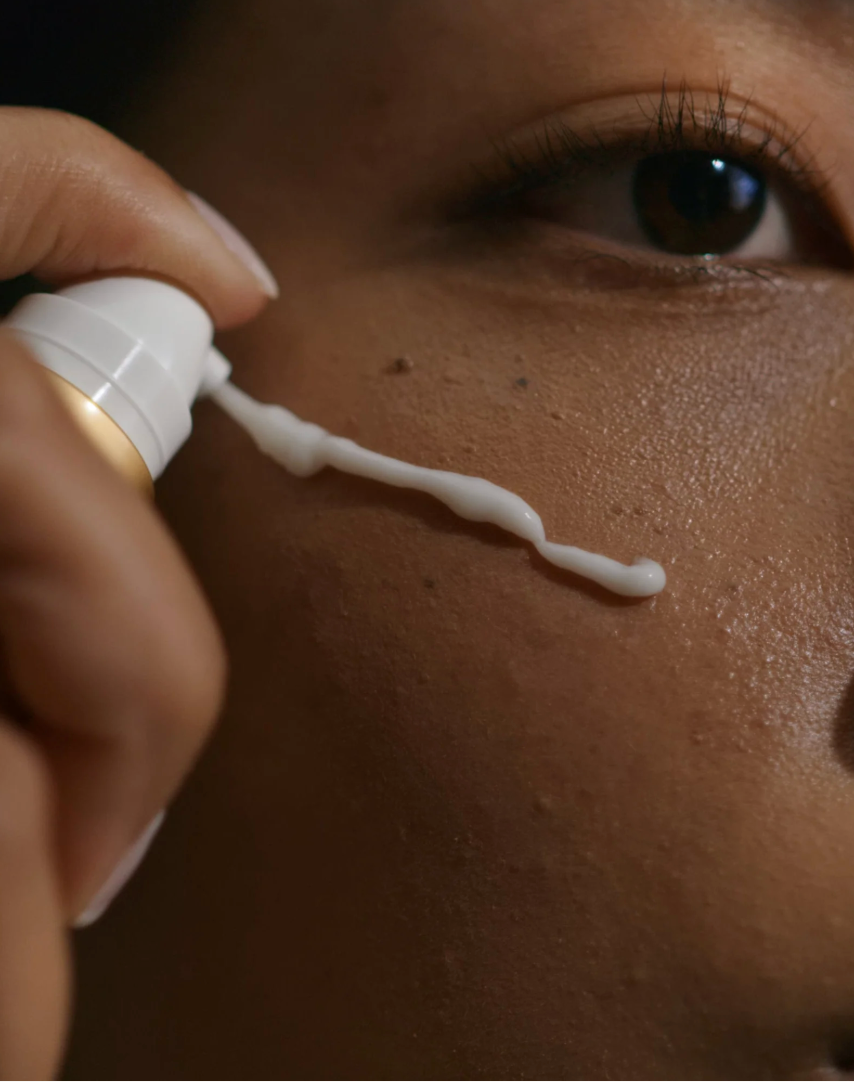 white facial in a bottle serum being applied to a face